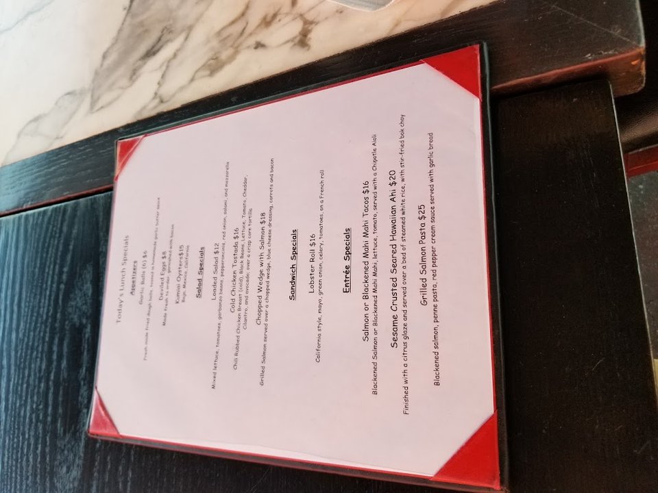 Menu layout showing appetizers, salads, and fish dishes.