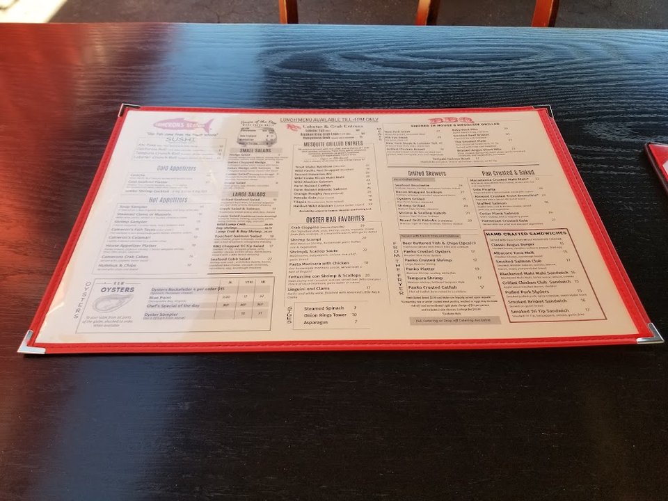 Menu layout showing appetizers, salads, and fish dishes.